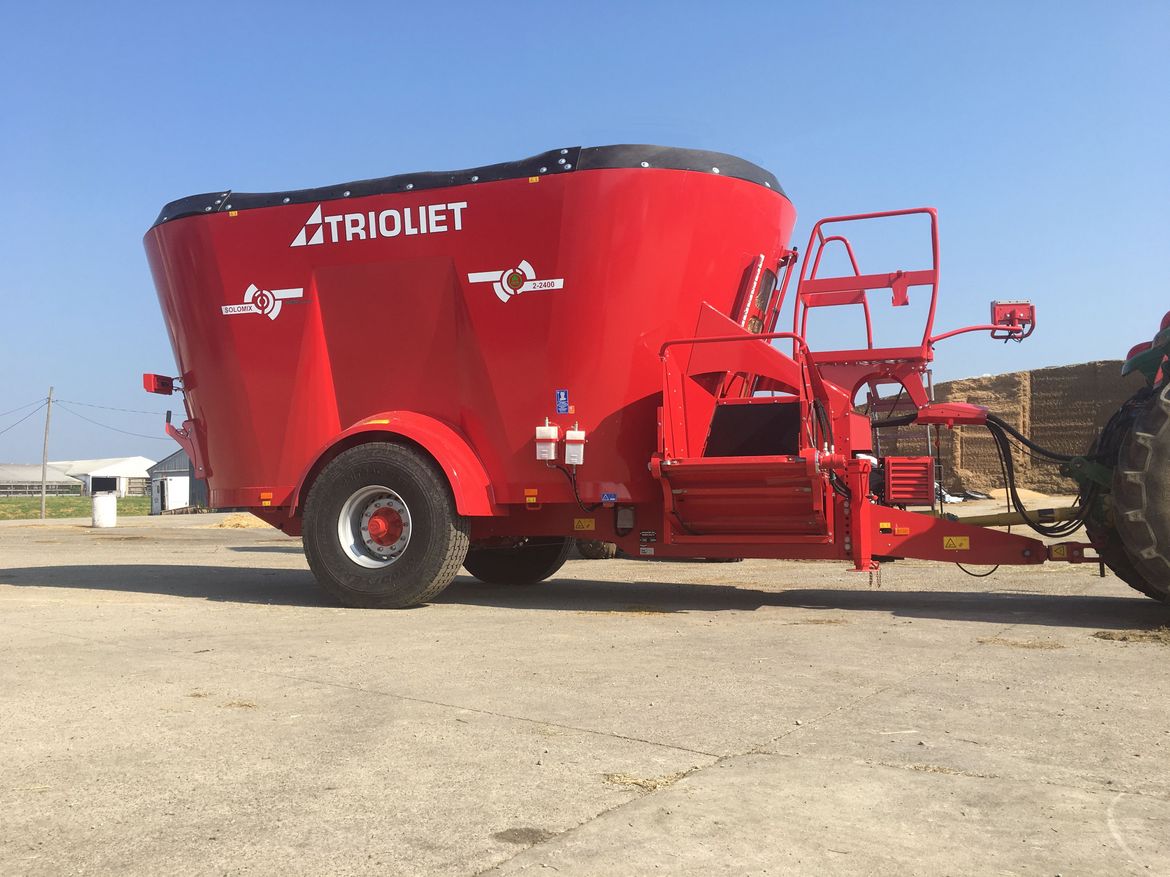Cows-are-fed-by-a-diet-feeder-or-feed-mixer-wagon